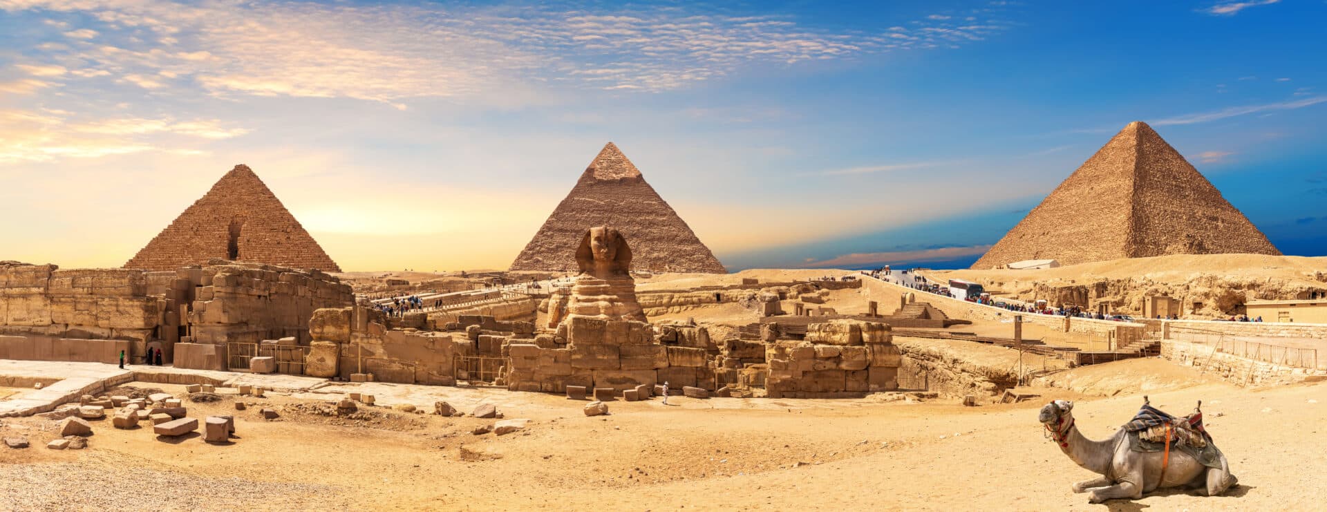 Giza Pyramids and Sphinx panorama with a camel lying by, Cairo,